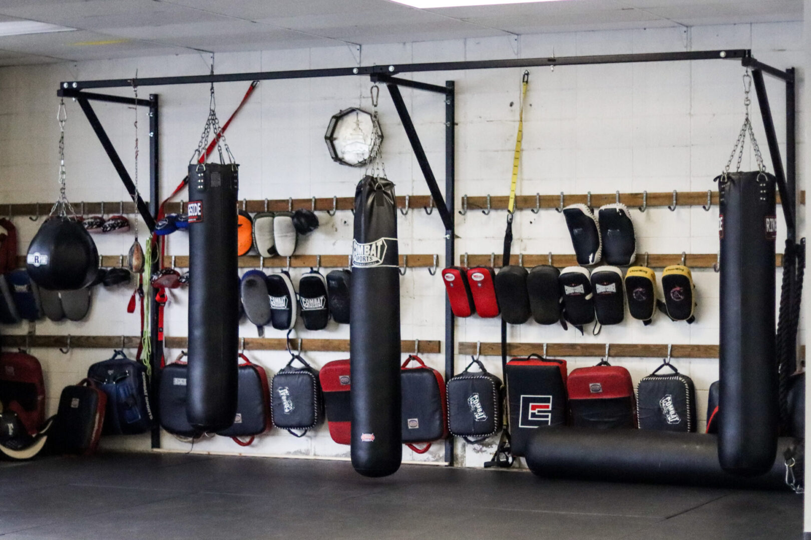 A gym with many different types of boxing equipment.