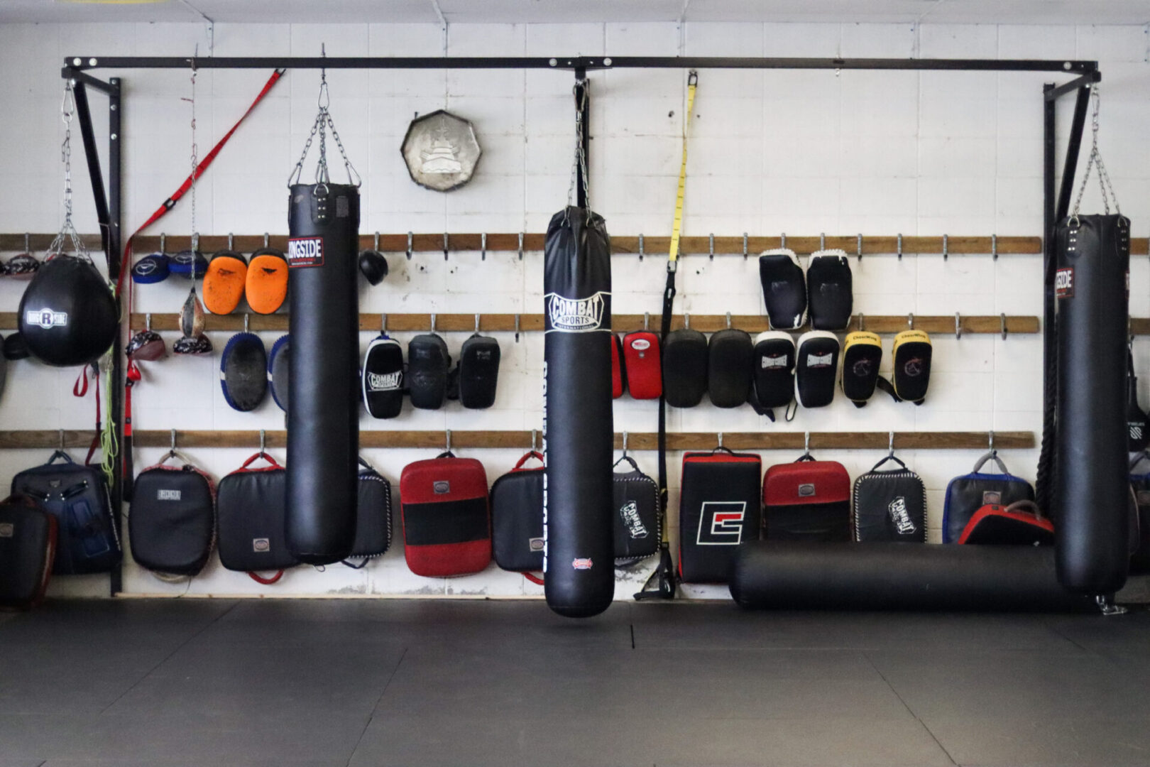 A wall of boxing gloves and punching bags.